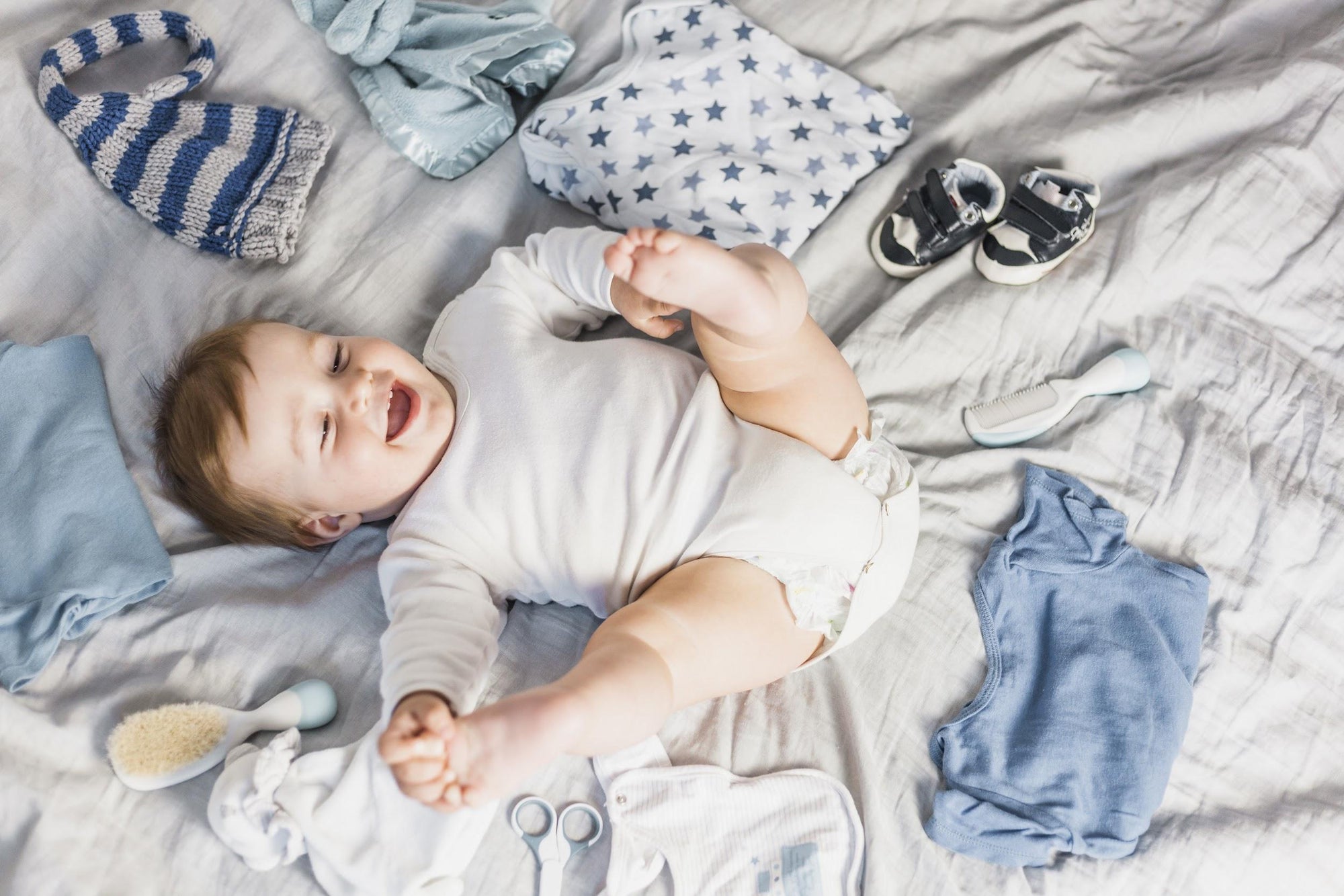 happy baby laying on organic fabric