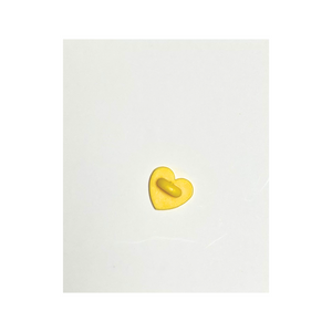 the wee bean egg tart pin with yellow 
child safe soft rubber backing