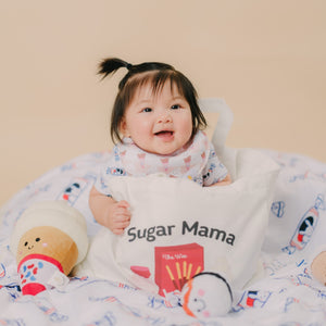 cute baby inside the wee bean's canvas tote bag in sugar mama
