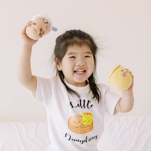 kid playing with the wee bean fair trade handmade rattle dolls