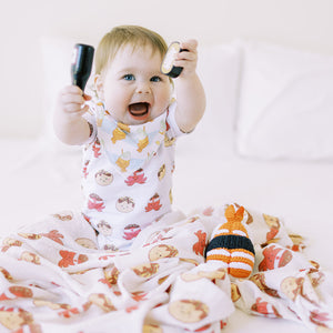 cute baby wearing the wee bean organic cotton bib set in taiyaki takoyaki