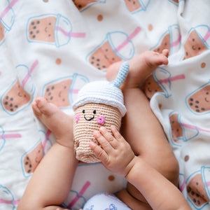 baby playing with the wee bean fair trade boba bubble tea bean rattle doll handmade charity