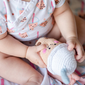 baby playing with the wee bean pebblechild fair trade handmade boba bubble tea rattle doll for babies and toddlers