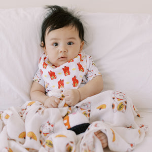 cute baby wearing the wee bean taste of japan lucky cat bib