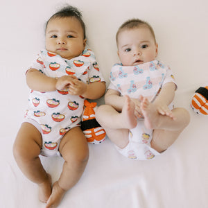 two cute babies in the wee bean organic cotton onesie and bandana bib sets ramen and sake