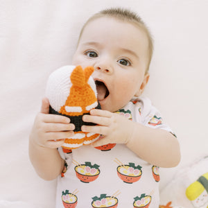 the wee bean fair-tradecute baby playing with the wee bean handmade dolls in shrimp ebi sushi rattle