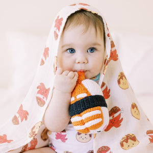 cute baby chewing on sushi doll in the wee bean organic cotton onesie romper in takoyaki taste of japan